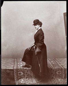 A female model posing in the studio of illustrator Malcolm Strauss, c.1895